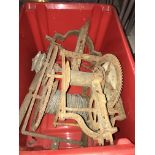 Two crates containing four iron clockwork mechanisms probably for turret or other large clocks (