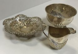 A collection of silverwares to include a pierced silver bonbon dish 15cm long x 4.5cm high, a silver