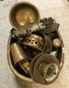 A quantity of various copper and brass ware to include bowls, stands, weights, coat hooks etc