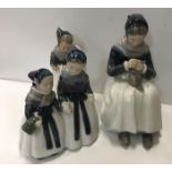 A collection of three Royal Copenhagen figures com