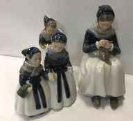 A collection of three Royal Copenhagen figures com