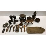 A collection of various ethnographica including pillow or head rest on tripod base, another