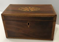 A Regency mahogany and inlaid tea caddy with fan m