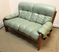 A mid 20th Century Norwegian Erkones teak framed pale green leather upholstered two seat sofa 137 cm