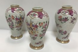 A set of three Samson of Paris urn-shaped vases decorated with armorials and floral sprays, 15 cm