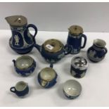 A collection of seven pieces of Wedgwood blue Jasper ware including teapot, water jug, cream jug,
