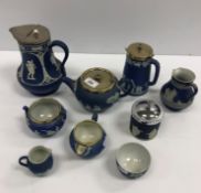 A collection of seven pieces of Wedgwood blue Jasper ware including teapot, water jug, cream jug,