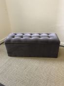 An Oliver Bonas grey buttoned upholstered box otto
