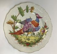 A Chelsea plate, the centre field decorated with a