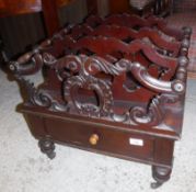 A mahogany four section Canterbury in the William IV manner with four carved dividers over a