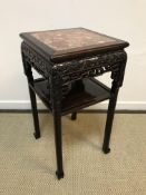 A Chinese rosewood urn stand of square form, the R
