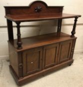 A Victorian mahogany buffet, the raised back over a single shelf on turned and fluted supports on