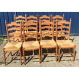 A set of eight modern pine rush seat ladder back dining chairs in the 19th Century manner, 42 cm