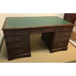 A modern mahogany double pedestal desk in the Georgian style, the tooled and gilded leather insert