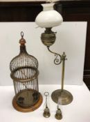 A modern brass decorative birdcage raised on circular wooden base approx. 88 cm high together with a