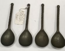 A set of four 18th Century pewter spoons the bowls of teardrop form with rope twist handles