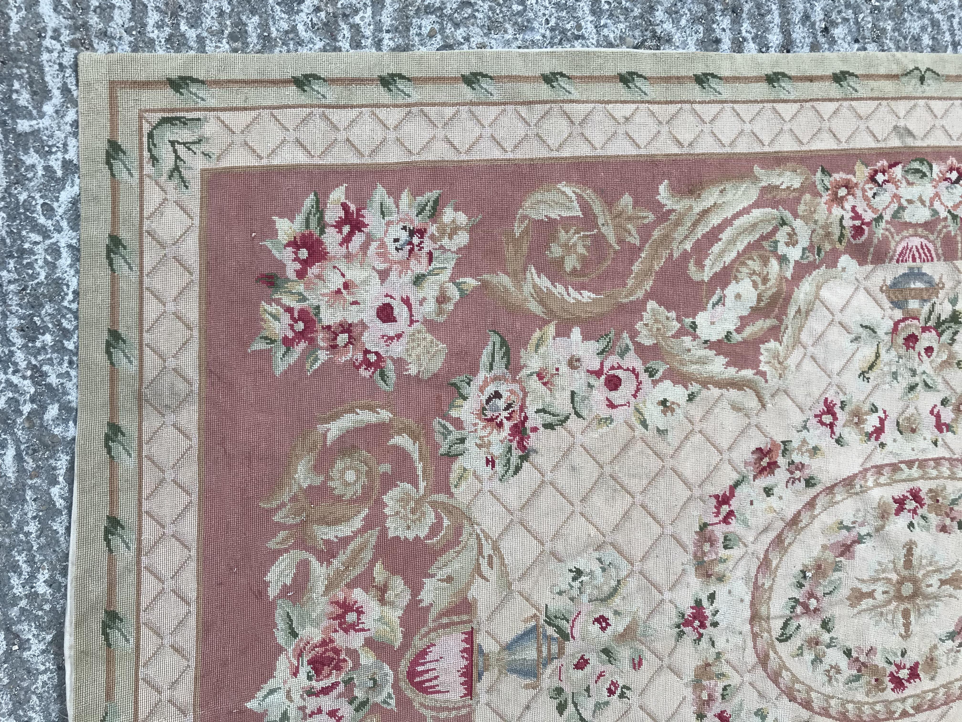 An Aubusson style rug, the central panel set with a floral decorated medallion on pale pink and dark - Image 2 of 12