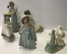 A collection of two Lladro figures "Girl with kittens" 21 cm high and "Girl in Summer dress"