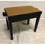 A modern Italian black lacquered adjustable piano stool of plain form raised on square supports 62.5