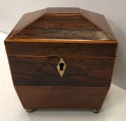 A small Regency rosewood sarcophagus shaped single