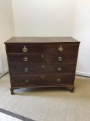 A 19th Century mahogany chest, the cross banded and barber pole strung top over two short and