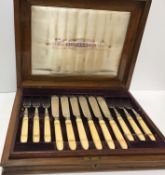 A cased set of twelve Victorian silver bladed and tined fish knives and forks (Sheffield 1874 by