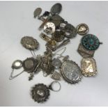 A collection of various silver and white metal Victorian and later brooches, lockets etc approx. 3