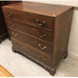 A 19th Century mahogany square front chest of four long drawers with brass swan neck handles