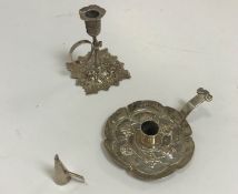 A Victorian silver miniature chamberstick with leaf decoration to sconce and base bearing makers