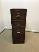 A vintage stained pine four drawer filing cabinet 45.5cm wide x 66cm deep x 127cm high