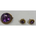 A diamond mounted and purple stone set brooch together with a pair of purple stone ear-rings