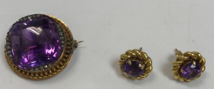 A diamond mounted and purple stone set brooch together with a pair of purple stone ear-rings