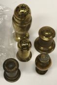 A collection of five various brass pots including an urn shaped caster 14.3 cm high, cylindrical