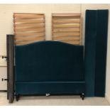 An "And so to Bed" teal velvet button upholstered