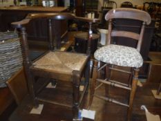 A 19th Century oak yoke-back rush seat corner chair on turned front leg united to the other three