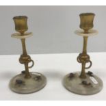 A pair of late 19th Century Italian lacquered brass and white onyx table candlesticks in the