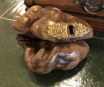 A carved burr wood box with lined interior