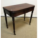 A late Regency mahogany and ebony strung fold over tea table on turned ringed and rope twist