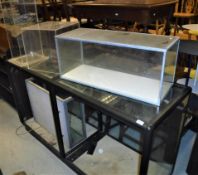 A 20th Century bakelite style shop display cabinet with glazed side all round and sliding doors to