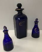 A pair of 19th Century Bristol blue decanters with gilt decoration one inscribed "Anchovy" the other