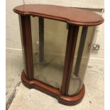 A modern mahogany framed and glazed kidney shaped display cabinet in the Victorian style 84 cm