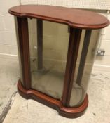 A modern mahogany framed and glazed kidney shaped display cabinet in the Victorian style 84 cm