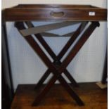 A 19th Century mahogany butler's tray of rectangular form raised on an associated folding stand 70.5