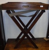 A 19th Century mahogany butler's tray of rectangular form raised on an associated folding stand 70.5