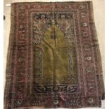 A late 19th Century Ghiordis, West Anatolia silk prayer rug with Mirhab design on a green ground,