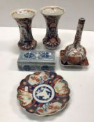 A pair of Imari palette trumpet vases 24 cm high together with a similarly decorated square dish