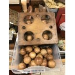 A set of four Taylor Rolff Co Ltd lawn bowls together with a collection of 55 treenware balls and