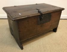 An early 18th Century oak coffer, the plank top wi