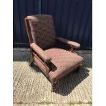 A Victorian mahogany framed upholstered armchair,