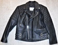 A Star Enterprise black leather motorcycle jacket, size 44"